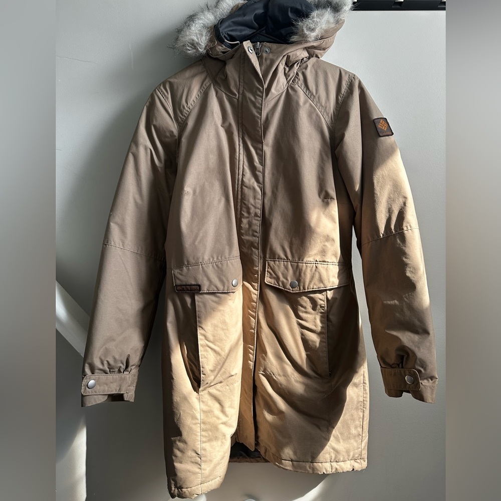Brown Hooded columbia Parka with faux Fur Trim.

Well worn, but no holes.
